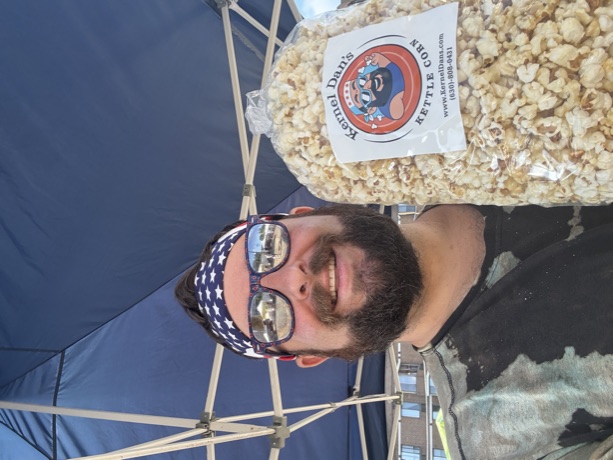 The Kernel in a stars-and-stripes bandana with a fresh bag under the tent